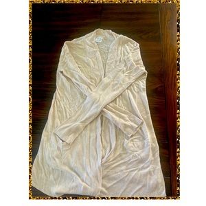 Cream color cardigan. A little longer than the usual cardigan.